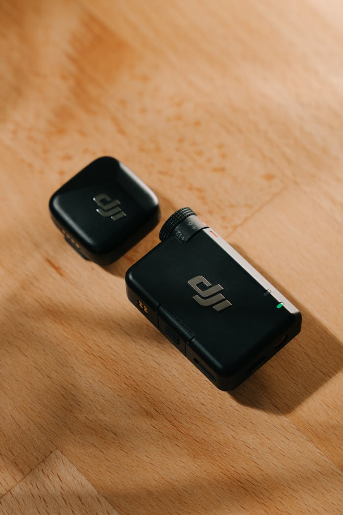gallery-1 Wireless microphone system with receiver on wooden surface with soft lighting.